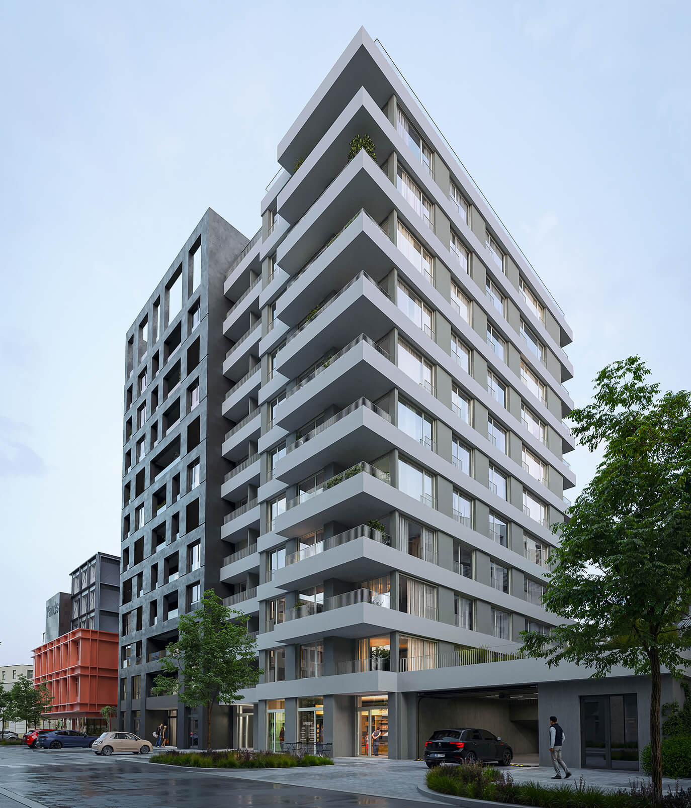 Exteriér novostavby Yards Žižkov s parkovacími úpravami u chodníku.